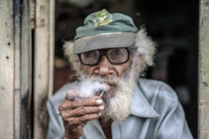Cuba, Havanna, old man smoking a cigar, portrait Cuba, Havanna, old man smoking a cigar, portrait